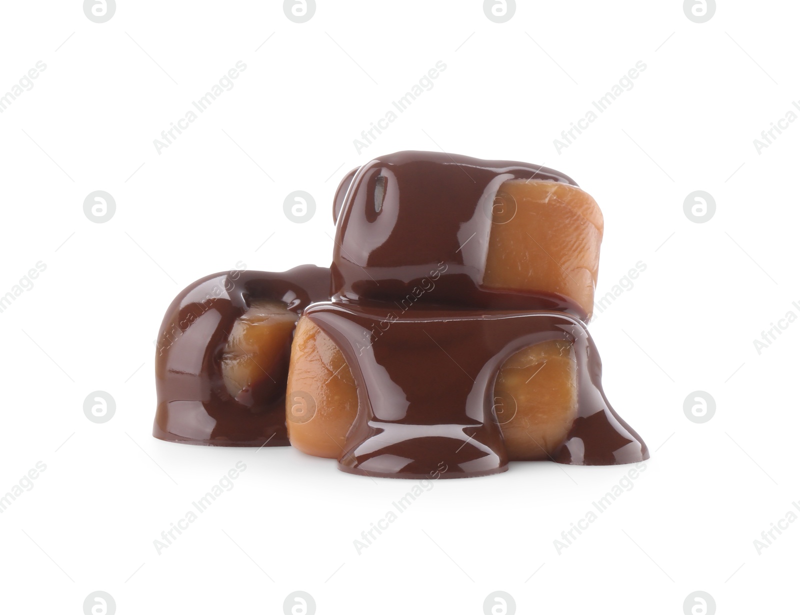 Photo of Delicious caramel candies with melted chocolate isolated on white