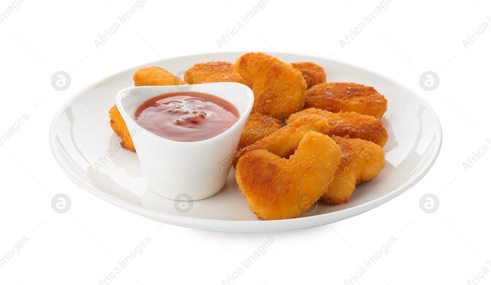 Photo of Tasty chicken nuggets with chili sauce isolated on white