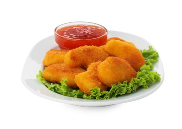 Photo of Tasty chicken nuggets with chili sauce and lettuce isolated on white