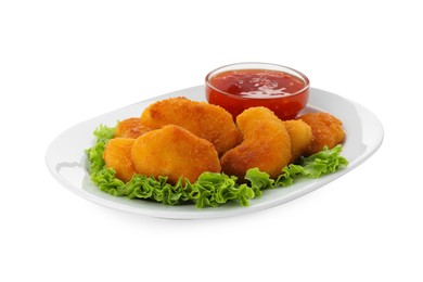 Photo of Tasty chicken nuggets with chili sauce and lettuce isolated on white