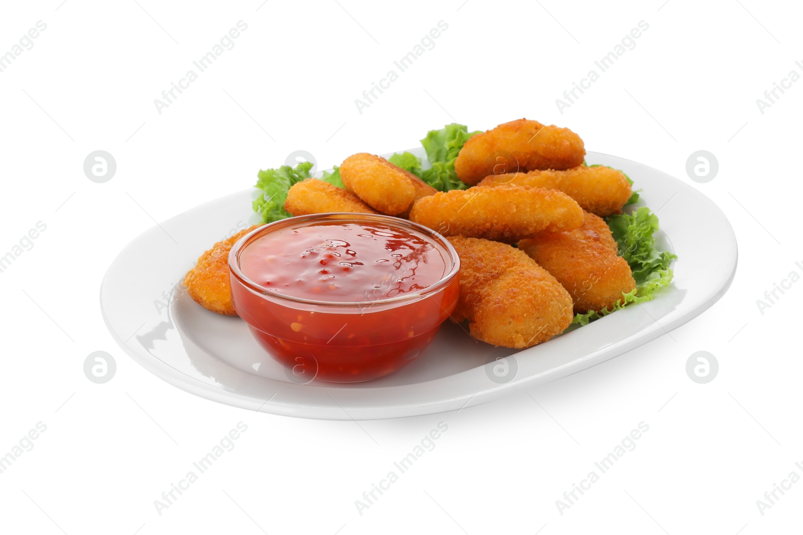 Photo of Tasty chicken nuggets with chili sauce and lettuce isolated on white