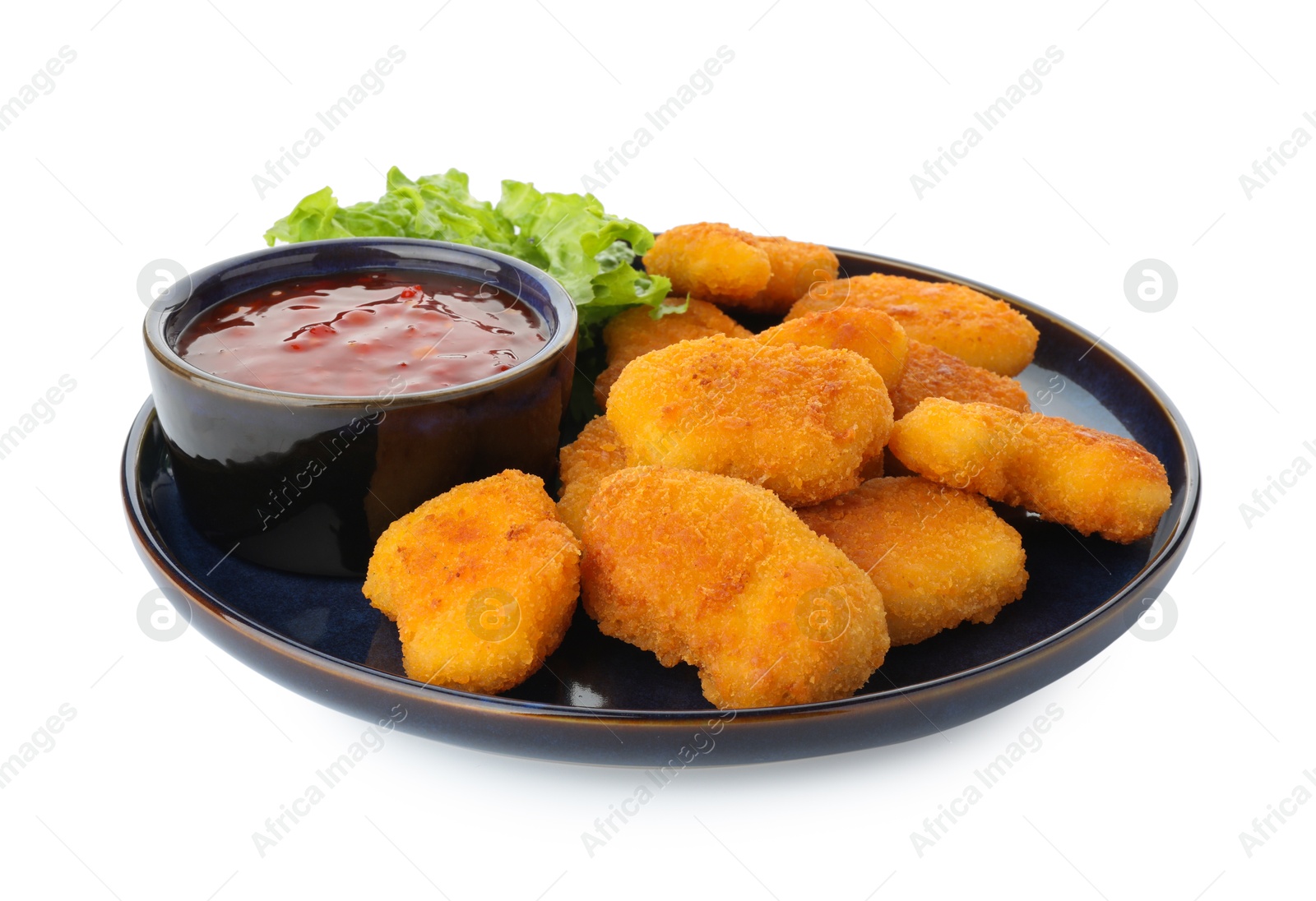 Photo of Tasty chicken nuggets with chili sauce and lettuce isolated on white