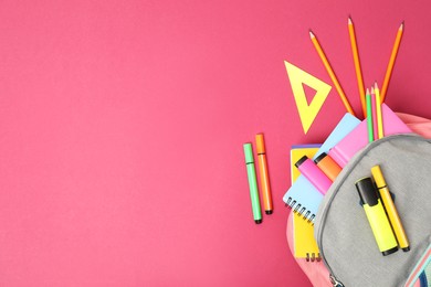 Photo of Backpack and different school supplies on pink background, flat lay. Space for text