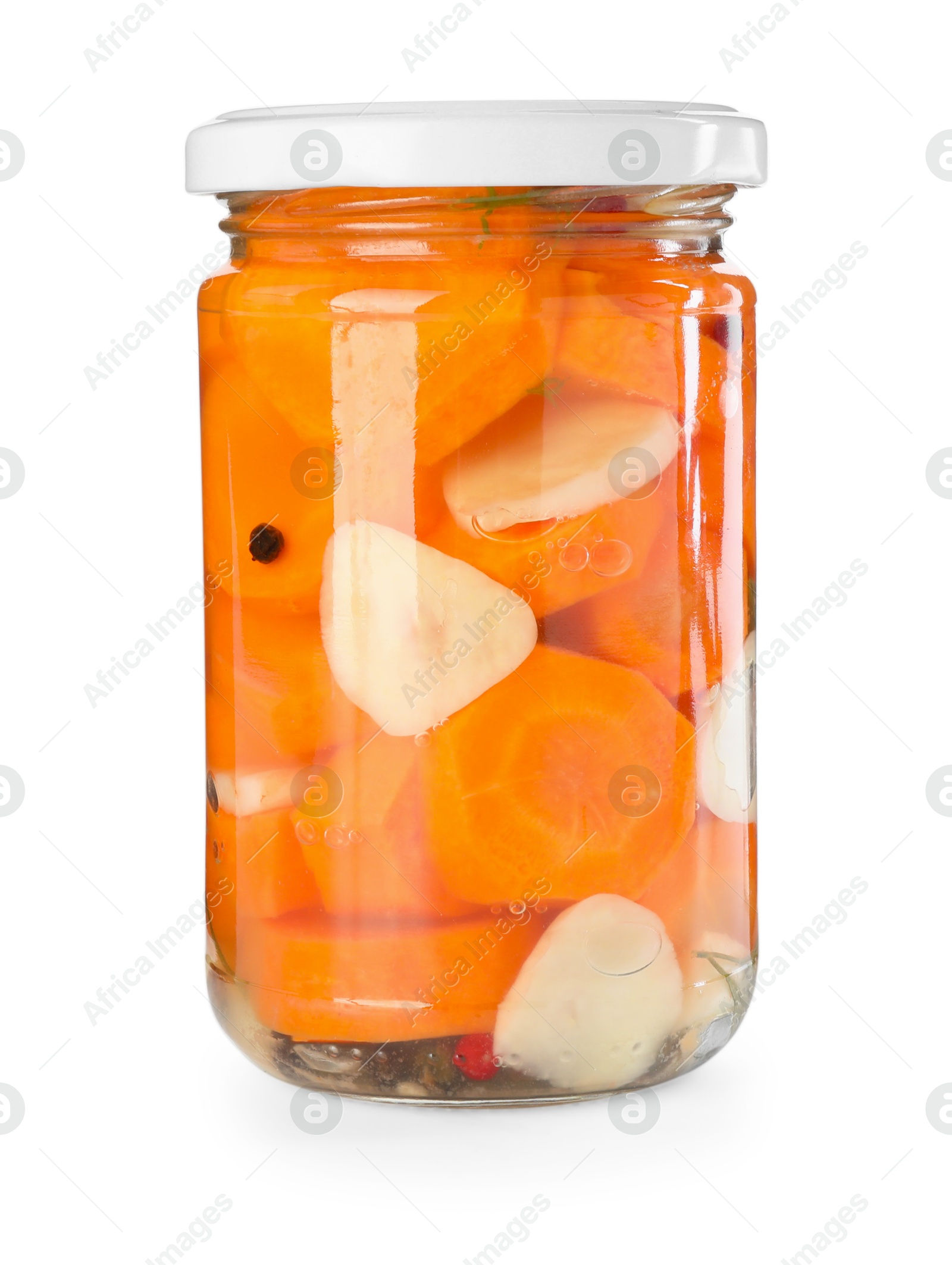 Photo of Tasty pickled carrots in jar isolated on white