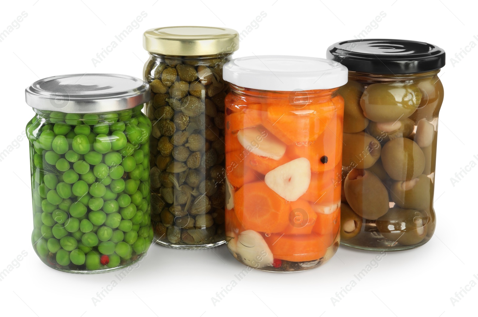 Photo of Different pickled products in jars isolated on white