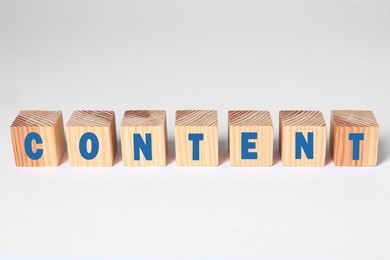 Image of Word Content made of wooden cubes with letters on white background