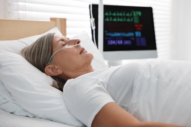 Coma patient. Mature woman sleeping in hospital bed