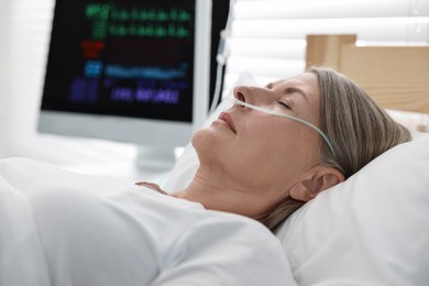 Coma patient. Mature woman sleeping in hospital bed