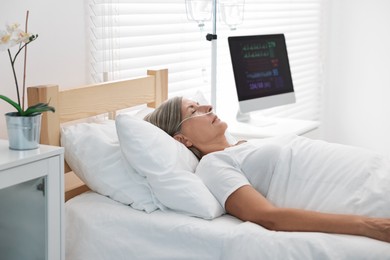 Coma patient. Mature woman sleeping in hospital bed