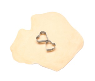 Photo of Raw dough and cookie cutters isolated on white, above view