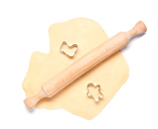 Raw dough, wooden rolling pin and cookie cutters isolated on white, top view