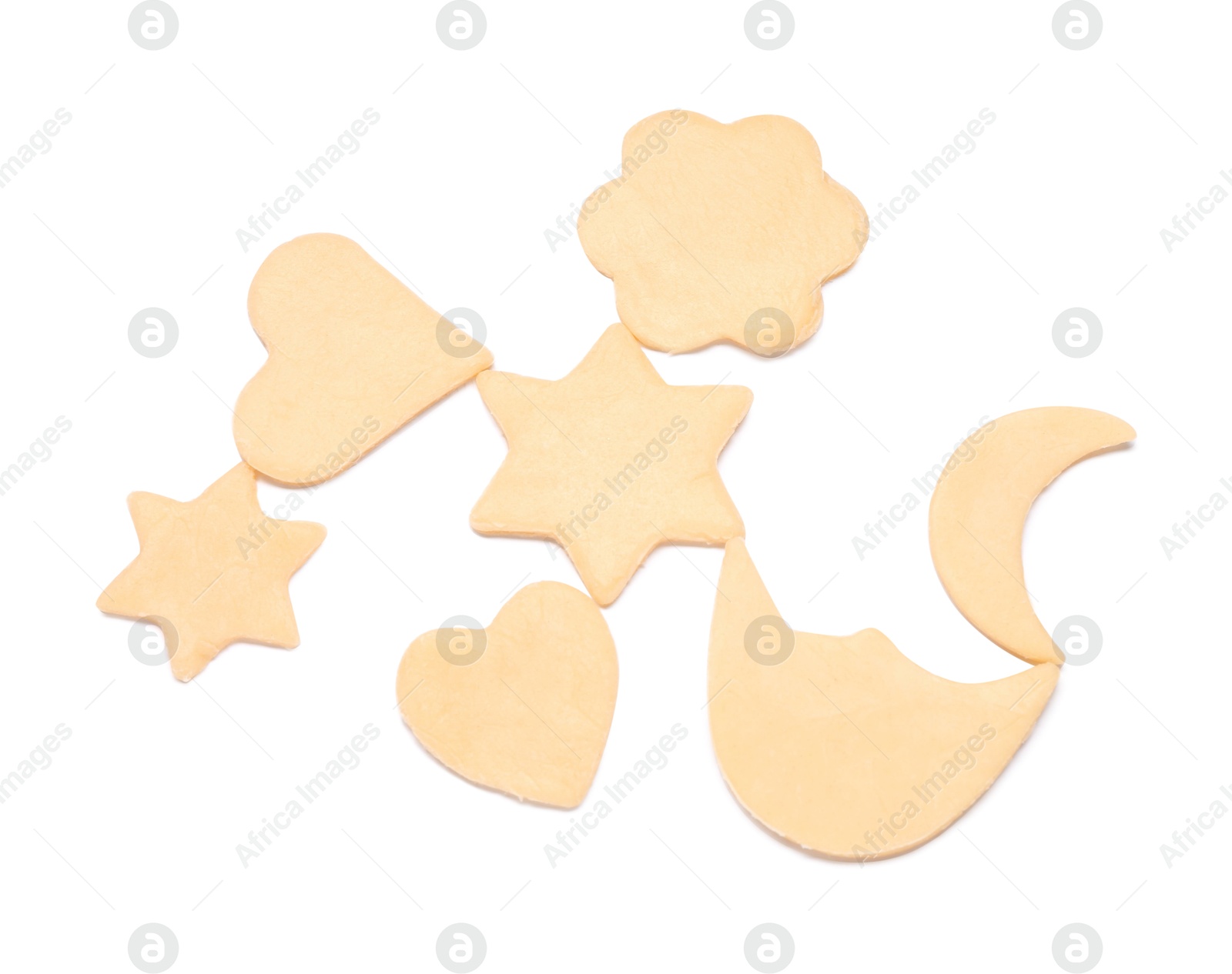 Photo of Raw cookies in different shapes isolated on white, top view