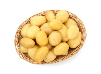 Photo of Young potatoes in wicker basket isolated on white, top view