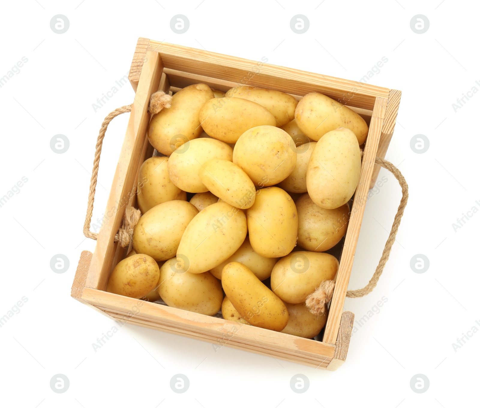 Photo of Young potatoes in wooden crate isolated on white, top view