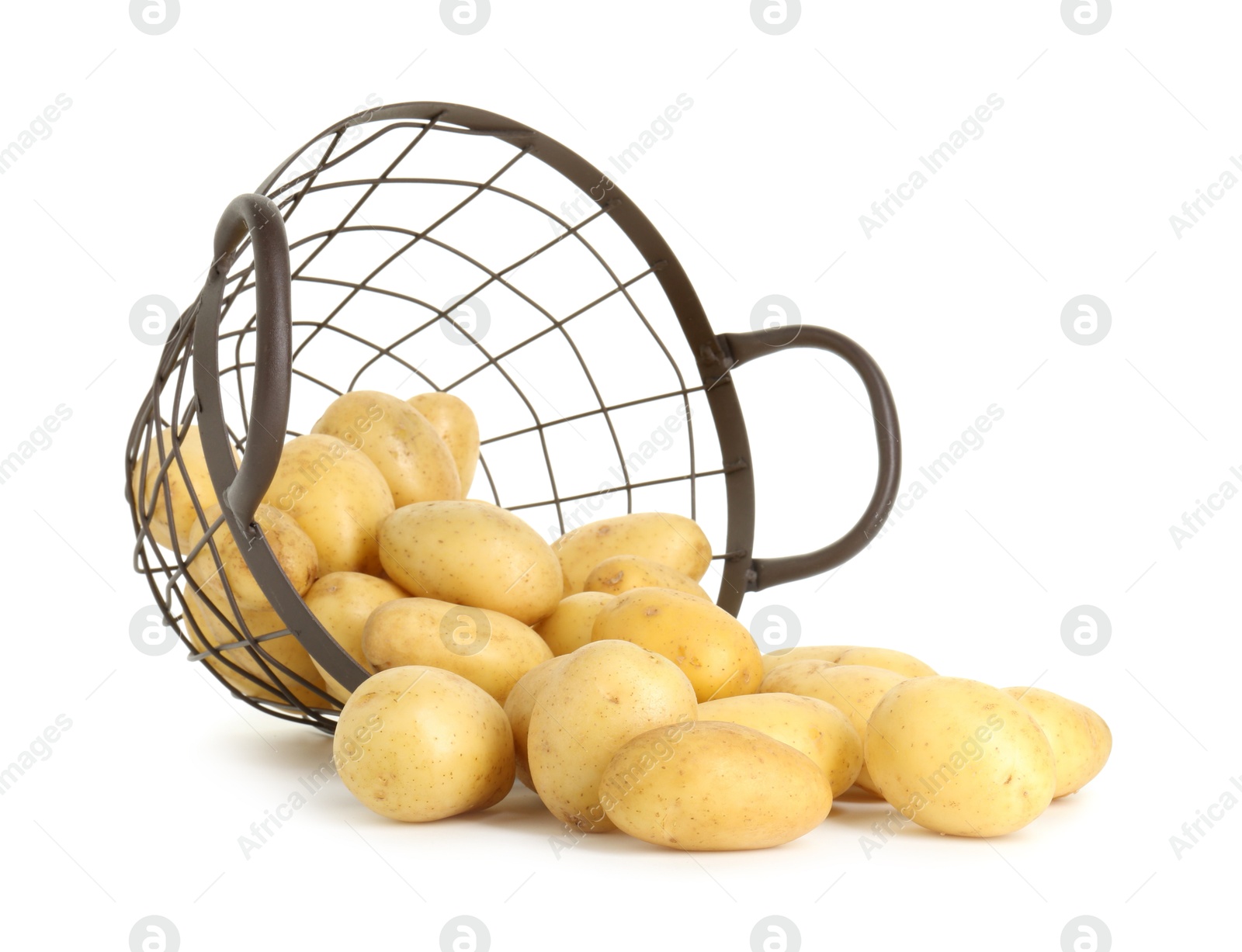 Photo of Young potatoes with metal basket isolated on white