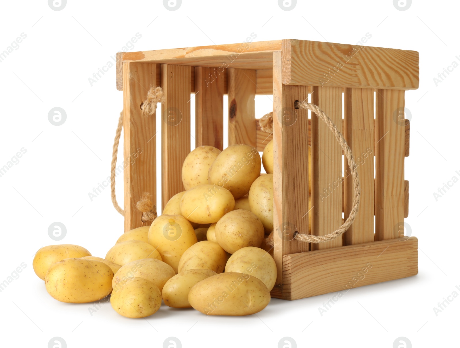 Photo of Young potatoes in wooden crate isolated on white