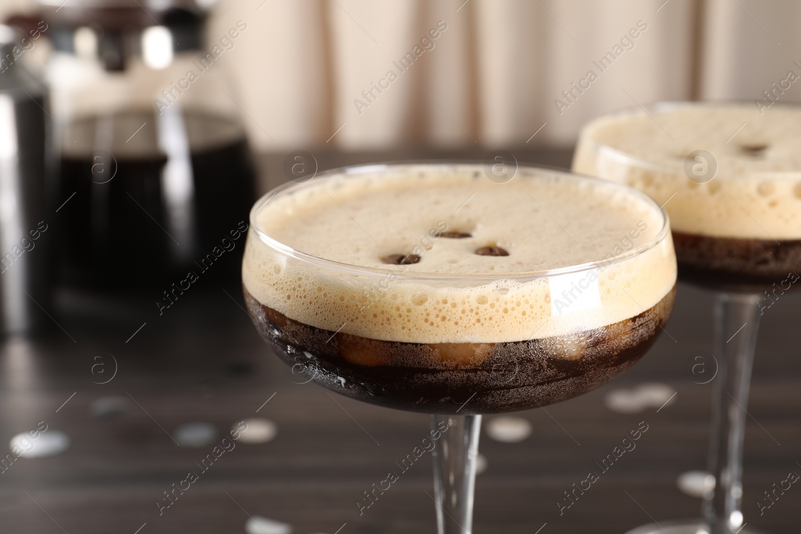 Photo of Fresh coffee cocktails in glasses on table, closeup