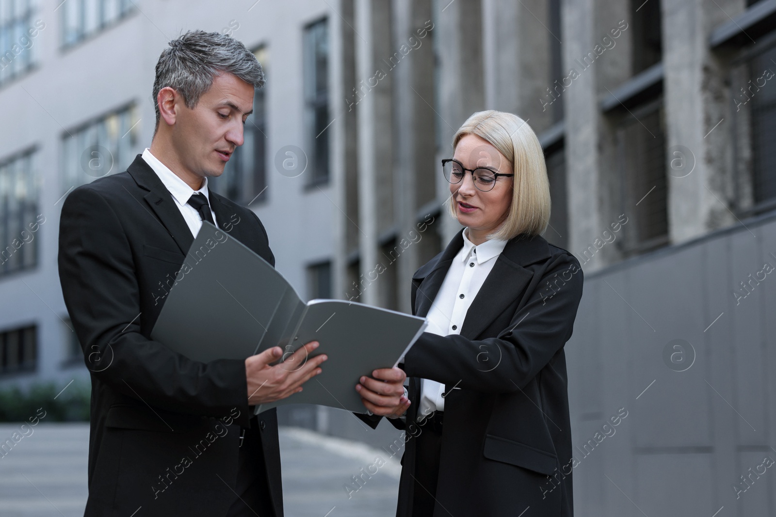 Photo of International relations. Diplomats talking during meeting outdoors