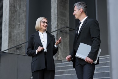 Photo of International relations. Diplomats talking during meeting outdoors