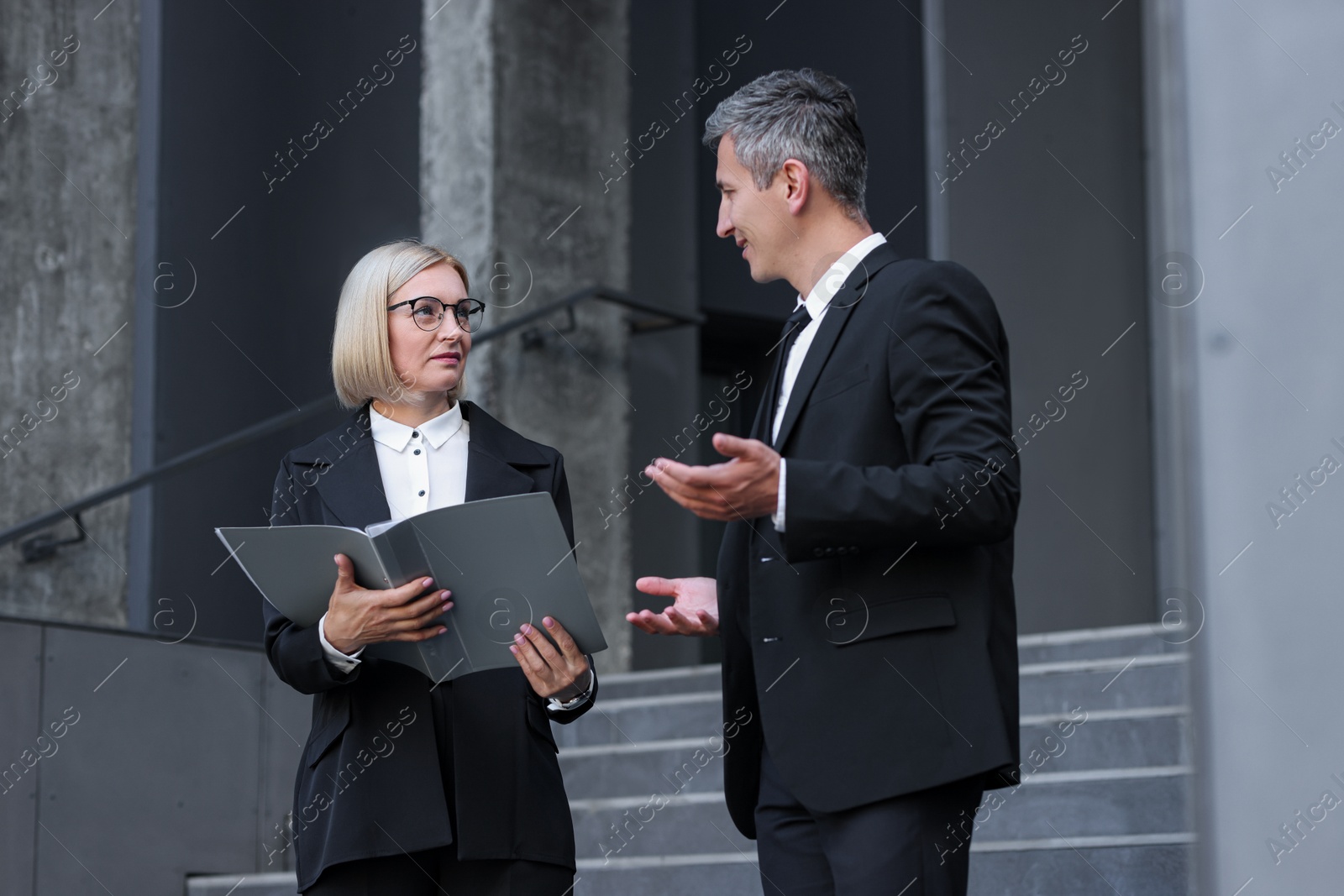 Photo of International relations. Diplomats talking during meeting outdoors