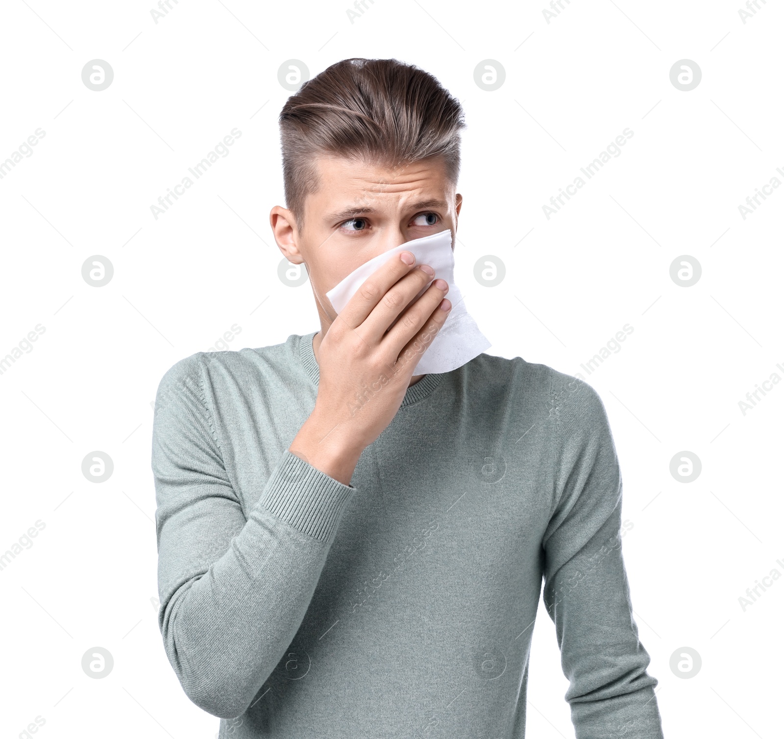 Photo of Young man with tissue suffering from sinusitis on white background