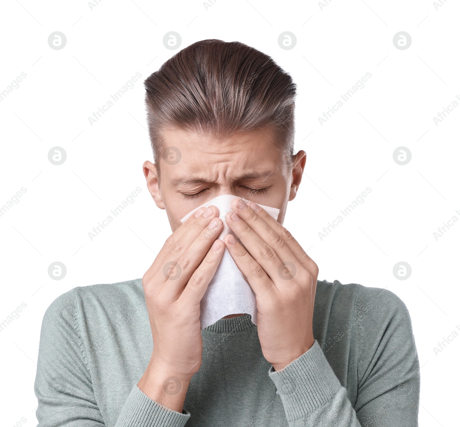 Photo of Young man with tissue suffering from sinusitis on white background