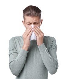 Photo of Young man with tissue suffering from sinusitis on white background