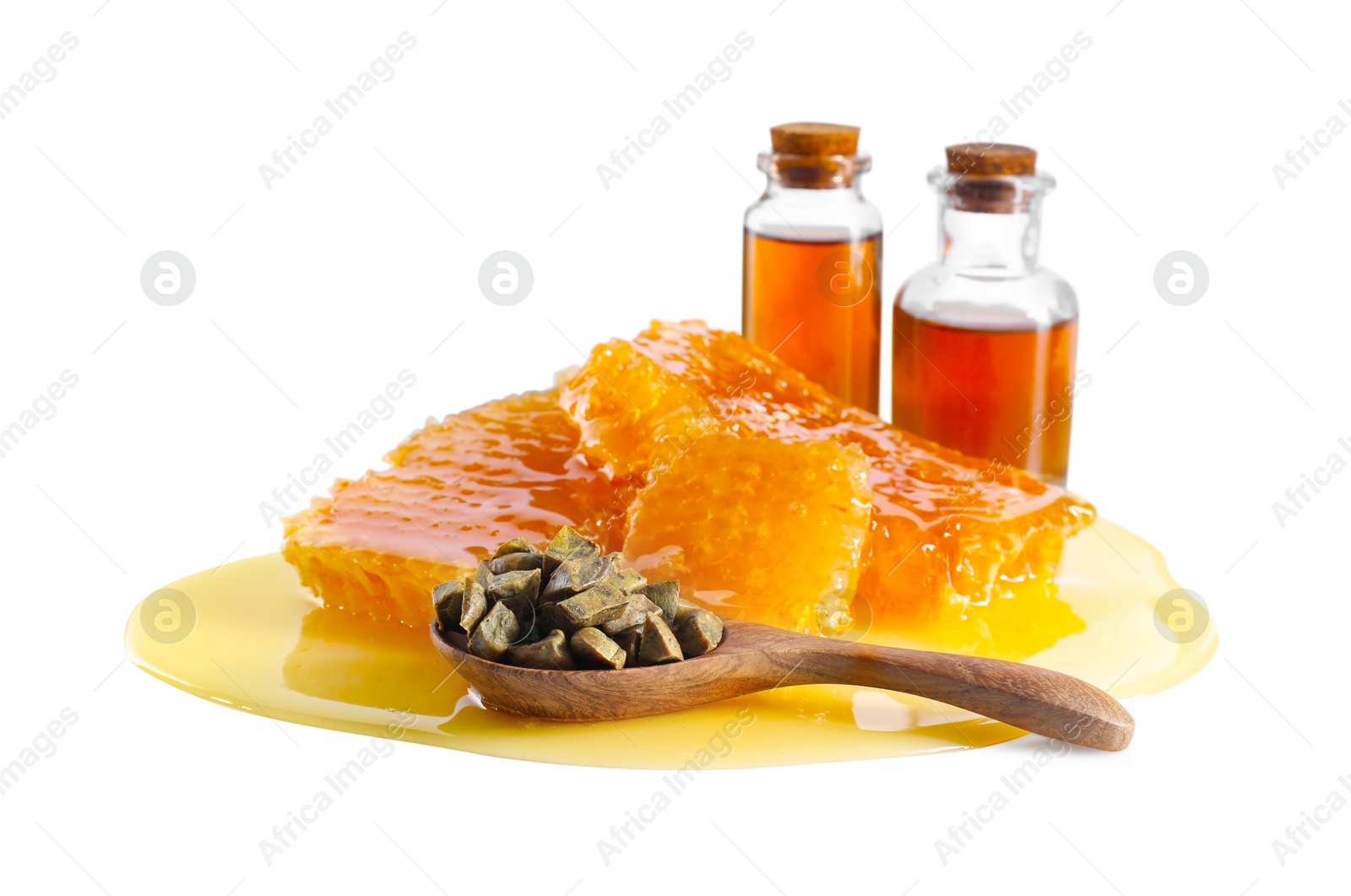 Photo of Natural honey tincture, propolis granules and sweet honeycombs isolated on white