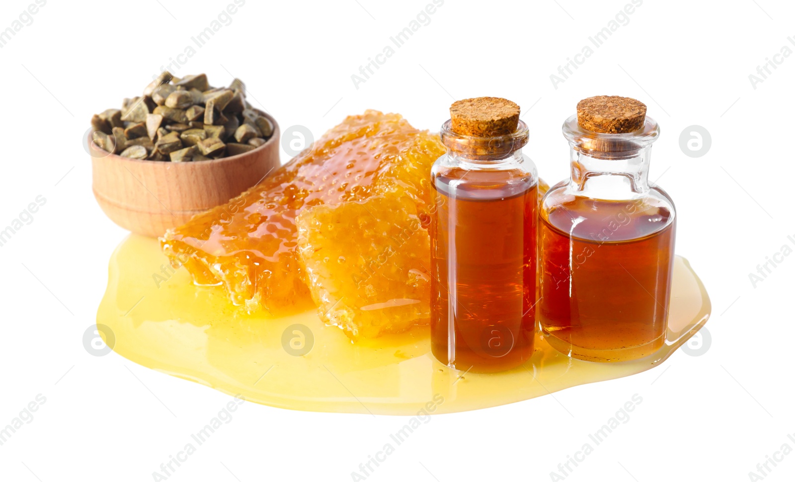 Photo of Natural honey tincture, propolis granules and sweet honeycombs isolated on white