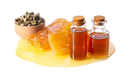 Photo of Natural honey tincture, propolis granules and sweet honeycombs isolated on white