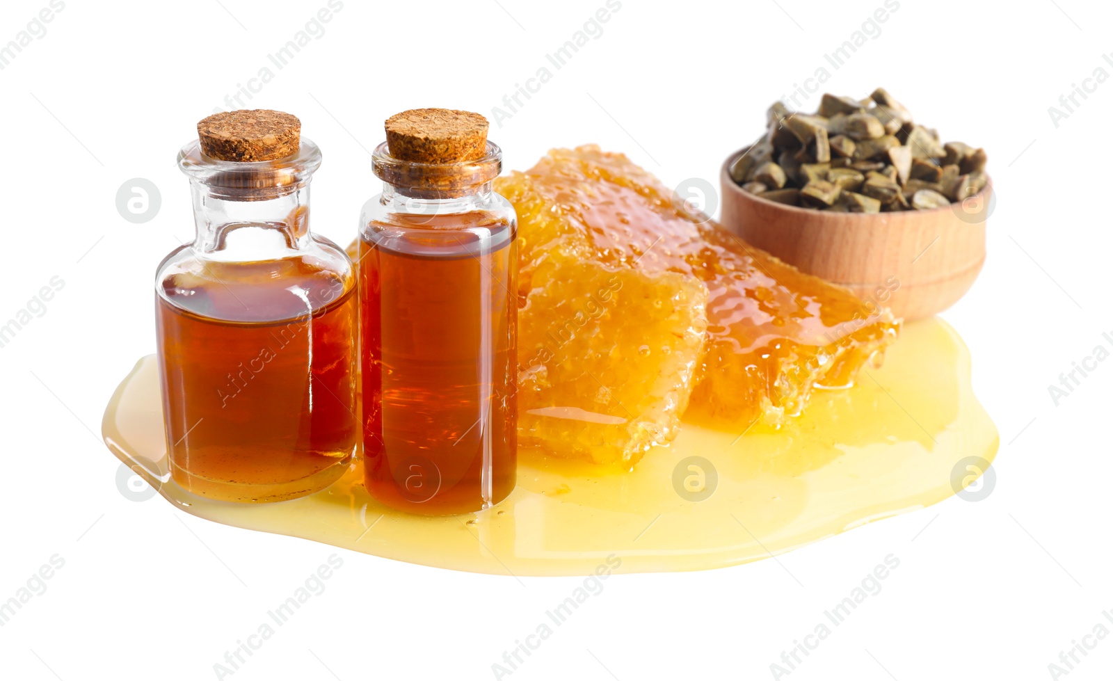 Photo of Natural honey tincture, propolis granules and sweet honeycombs isolated on white