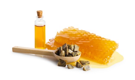 Photo of Natural honey tincture, propolis granules and sweet honeycombs isolated on white