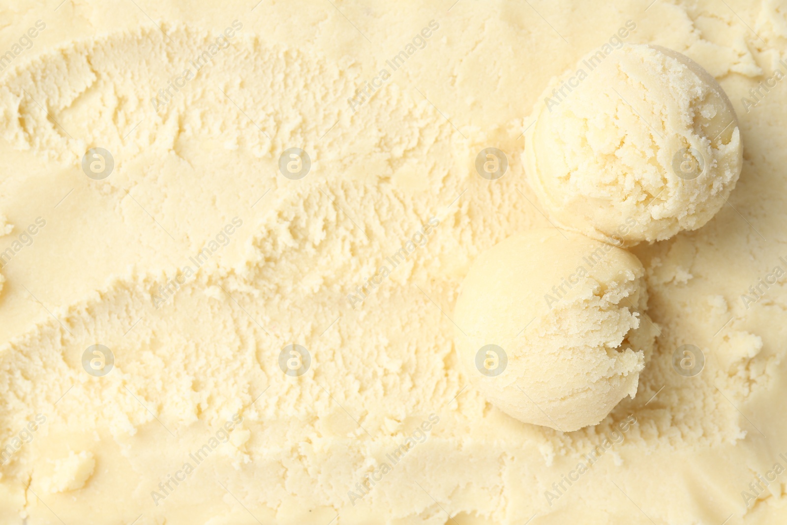 Photo of Scoops with tasty melon sorbet, top view. Space for text