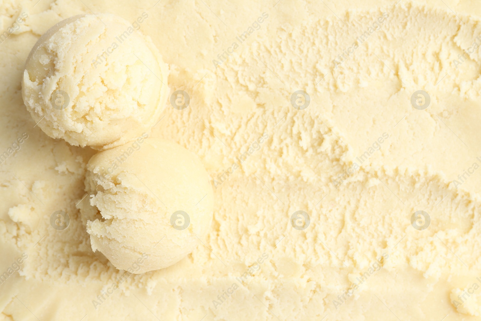 Photo of Scoops with tasty melon sorbet, top view. Space for text