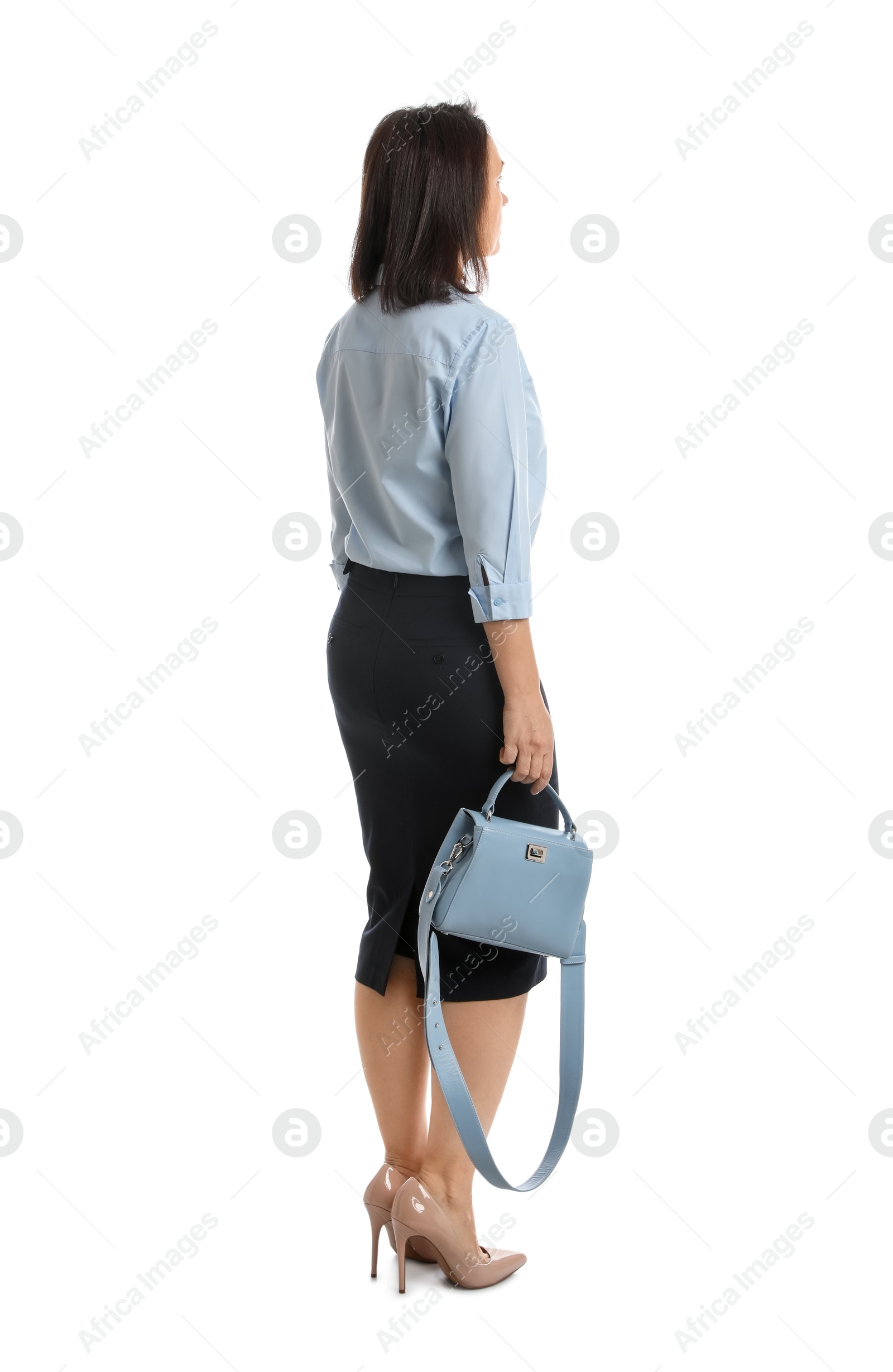 Photo of Mature woman in business attire with bag on white background