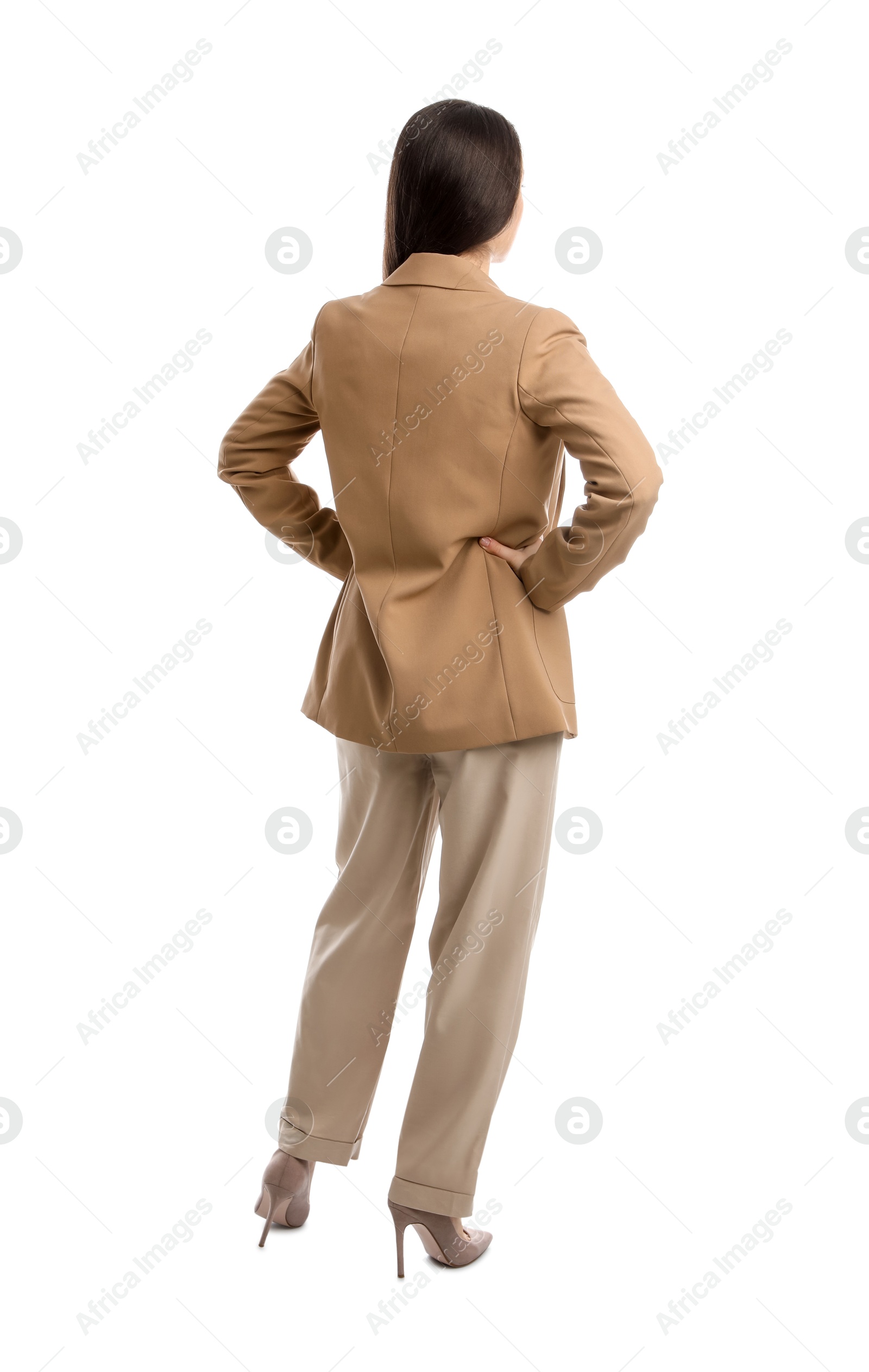 Photo of Young woman in business attire on white background, back view