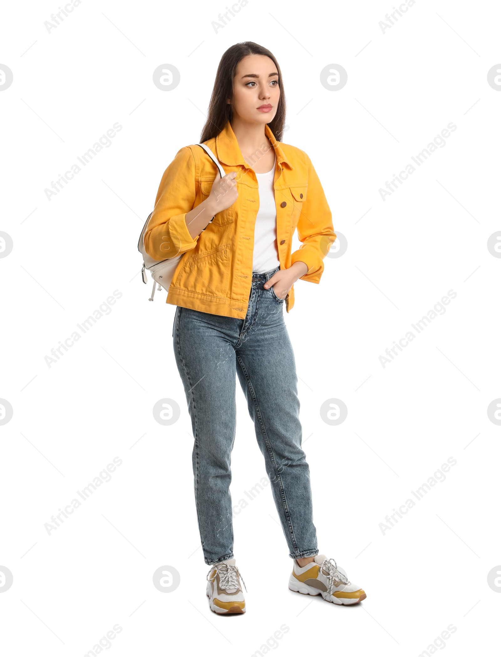 Photo of Young woman in casual clothes with backpack on white background