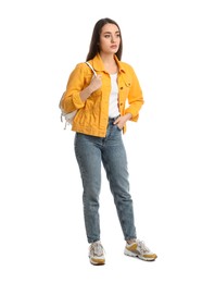 Photo of Young woman in casual clothes with backpack on white background