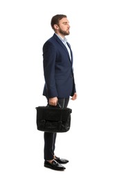 Young man in business attire with bag on white background