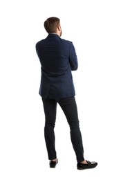 Young man in business attire on white background, back view