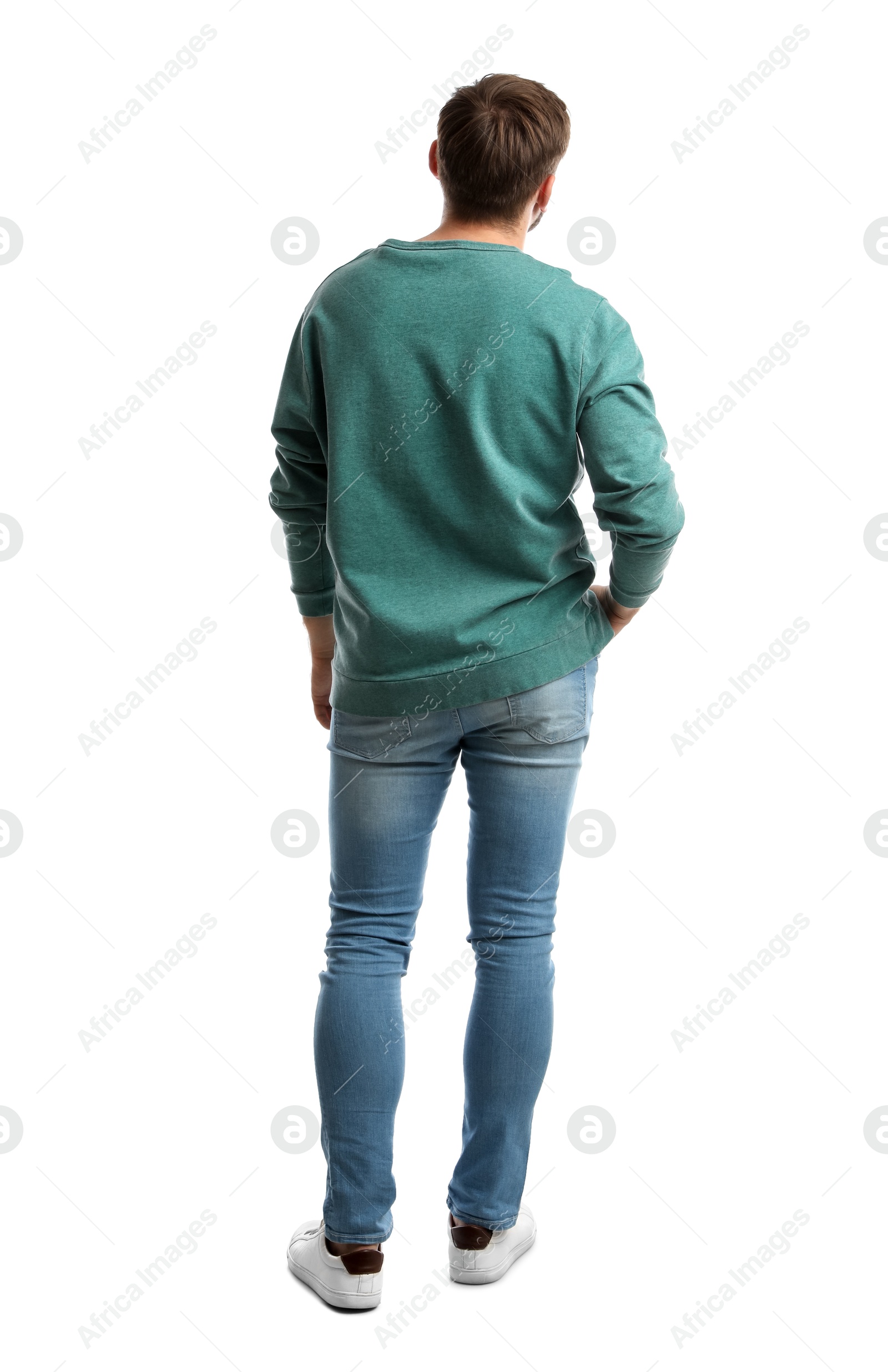 Photo of Young man in casual clothes on white background, back view