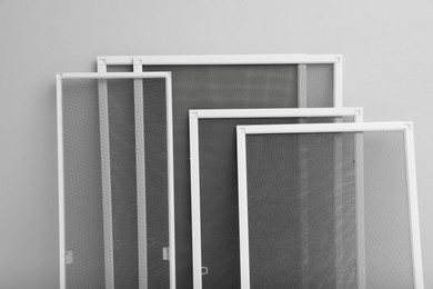 Photo of Set of window screens on light grey background