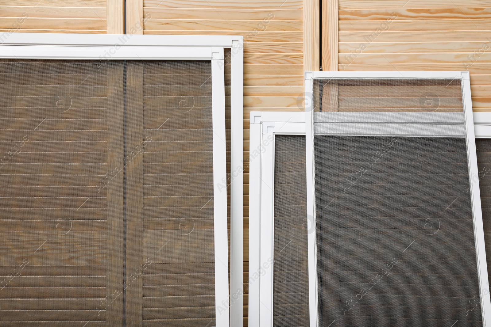 Photo of Set of window screens near wooden folding screen