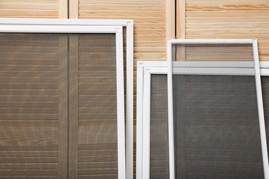 Set of window screens near wooden folding screen