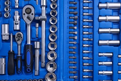 Photo of Auto mechanic's tools in plastic box, top view