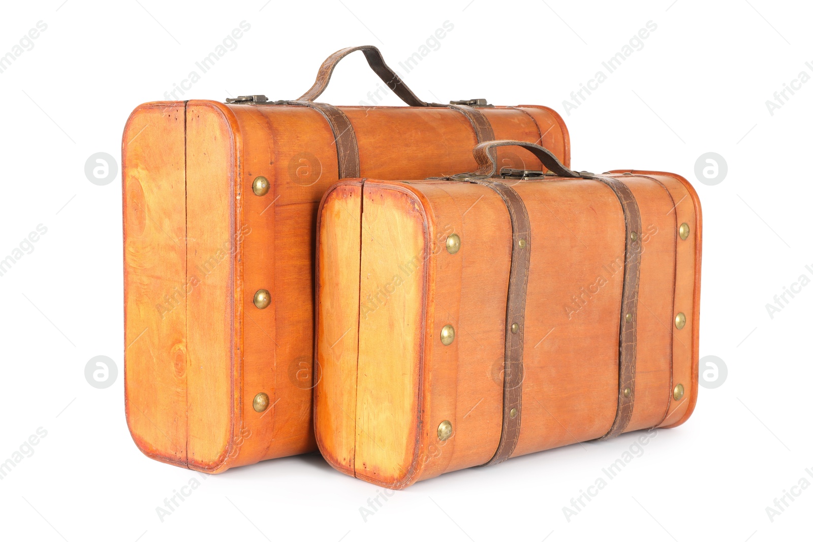 Photo of Two new wooden suitcases isolated on white