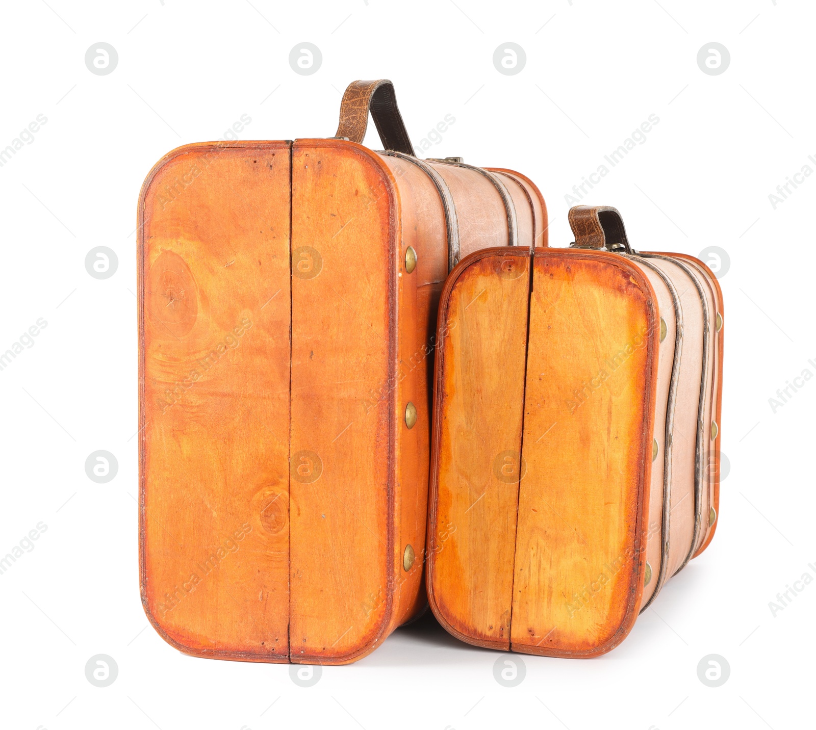 Photo of Two new wooden suitcases isolated on white