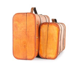 Photo of Two new wooden suitcases isolated on white