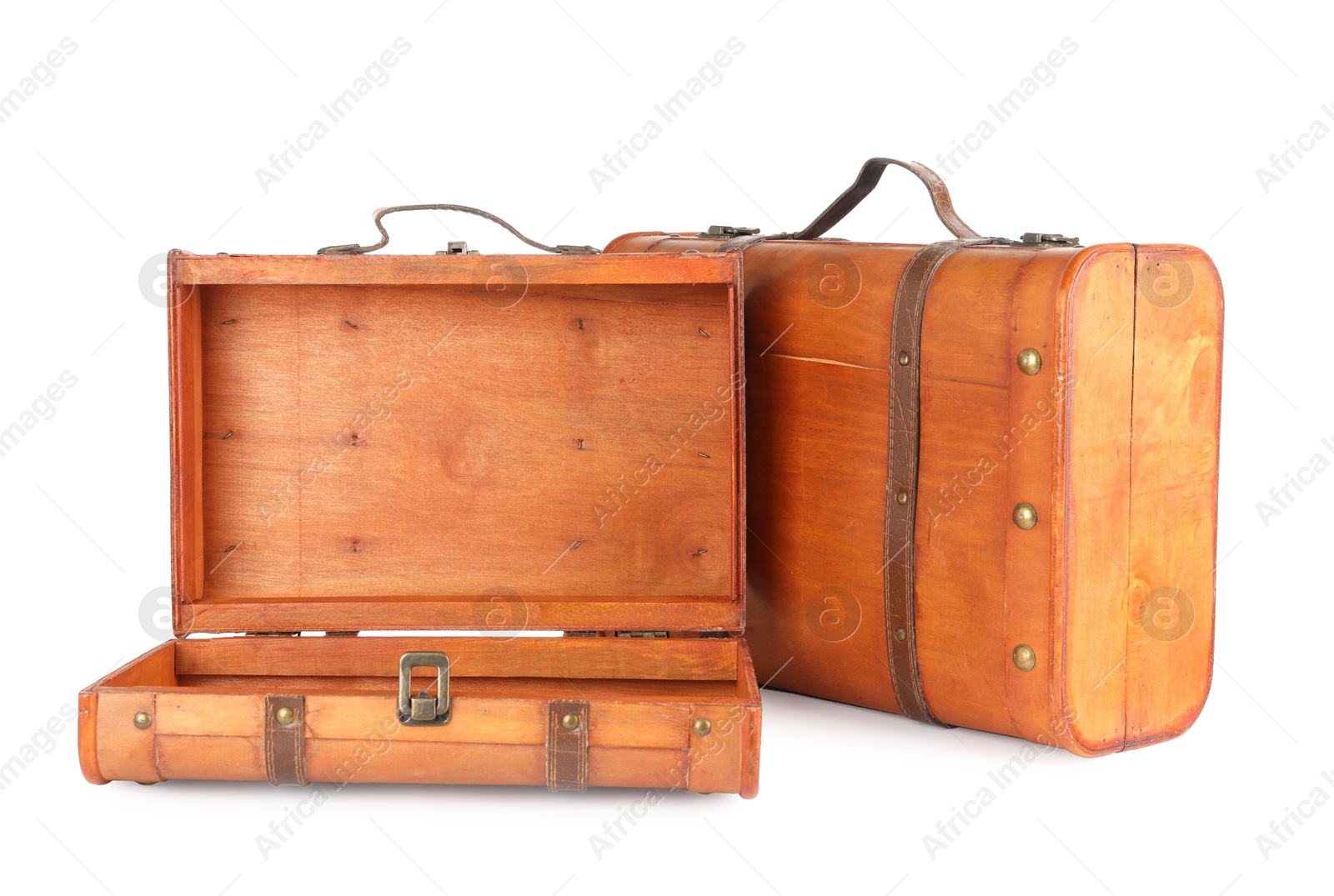 Photo of Two new wooden suitcases isolated on white