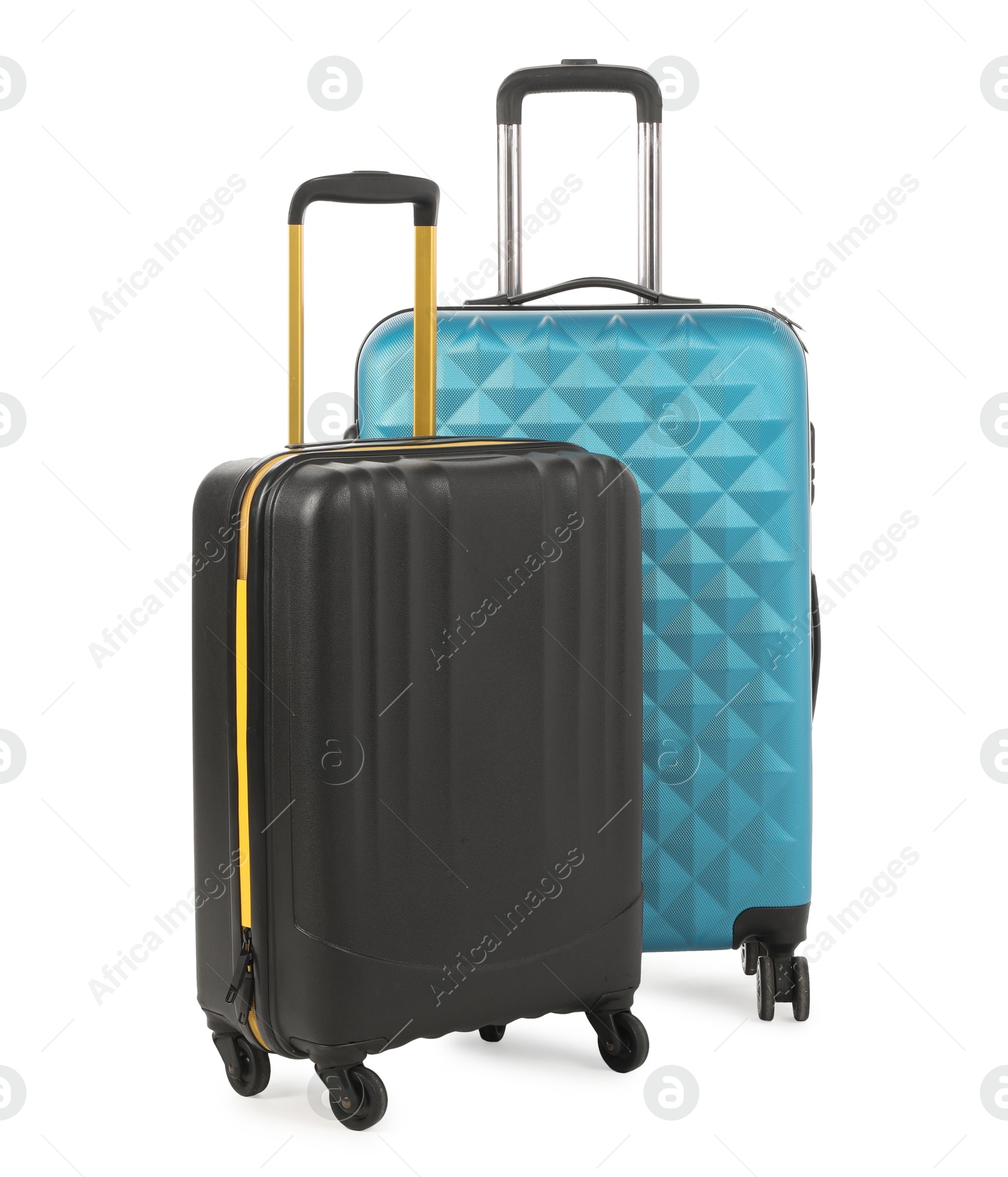 Photo of Two new light blue and black suitcases isolated on white